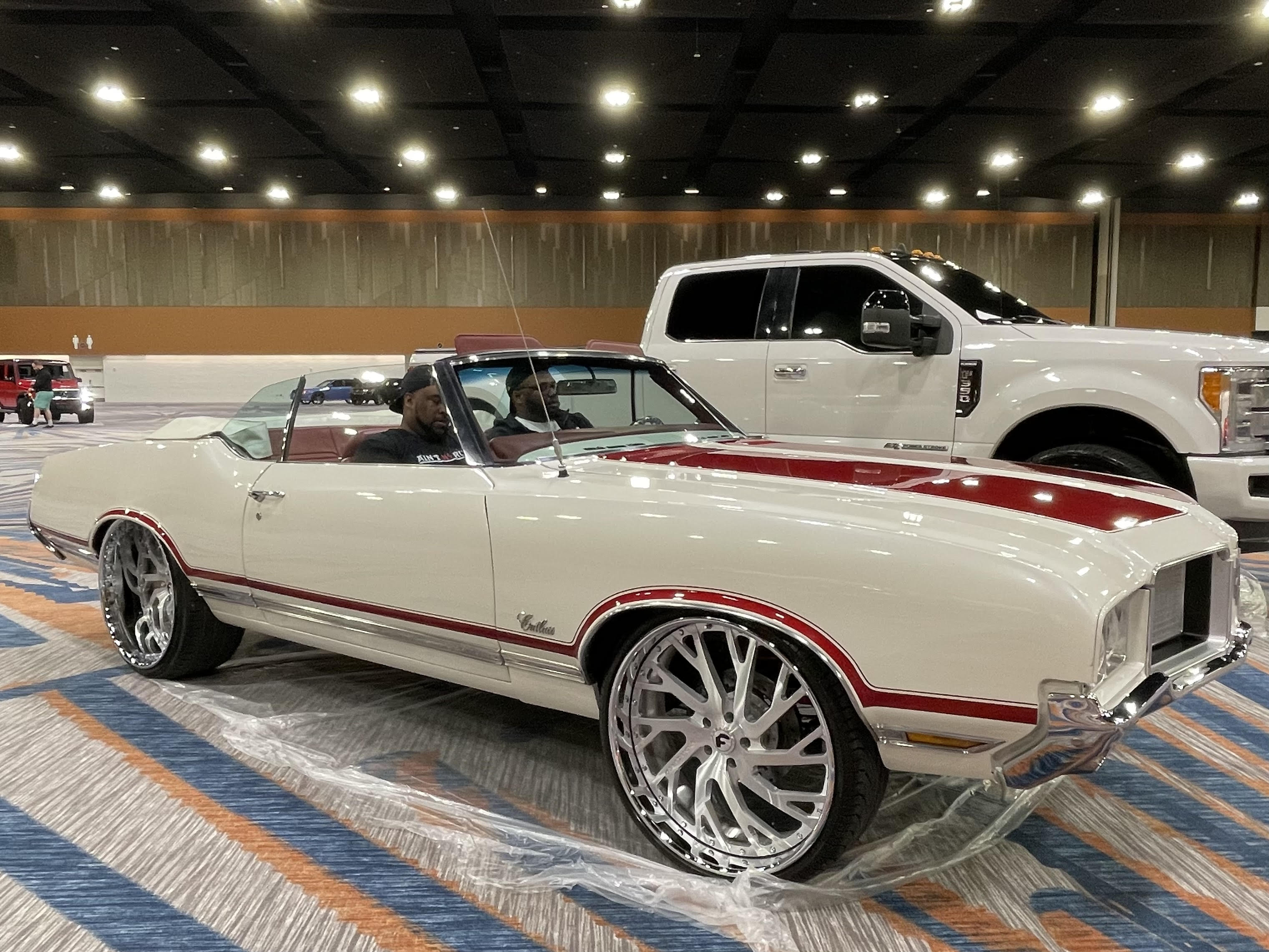 White and red custom convertible on display at the expo