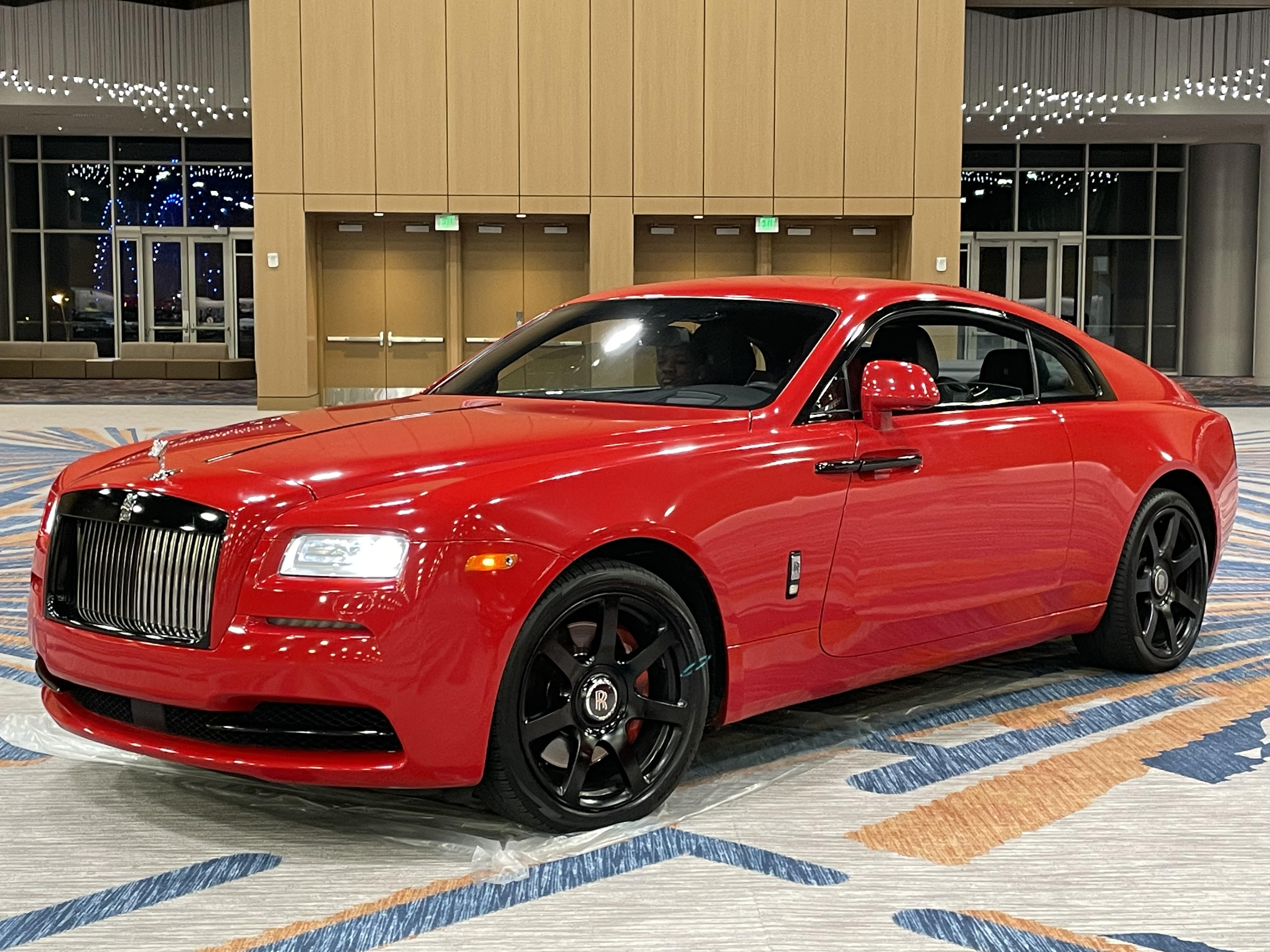 Red Rolls-Royce coupe displayed at the expo hall